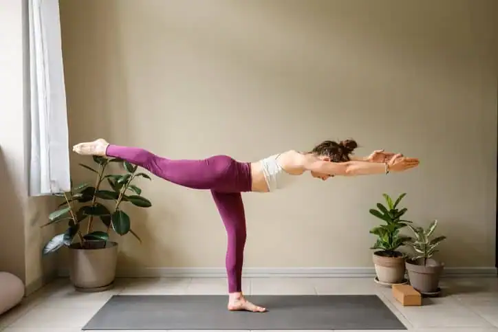Woman doing Yoga exercise Sevenoaks to help with toning the body. 