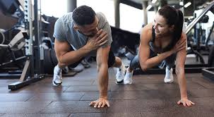 Image of man and woman doing Cardio Sevenoaks to tone their arms. 
